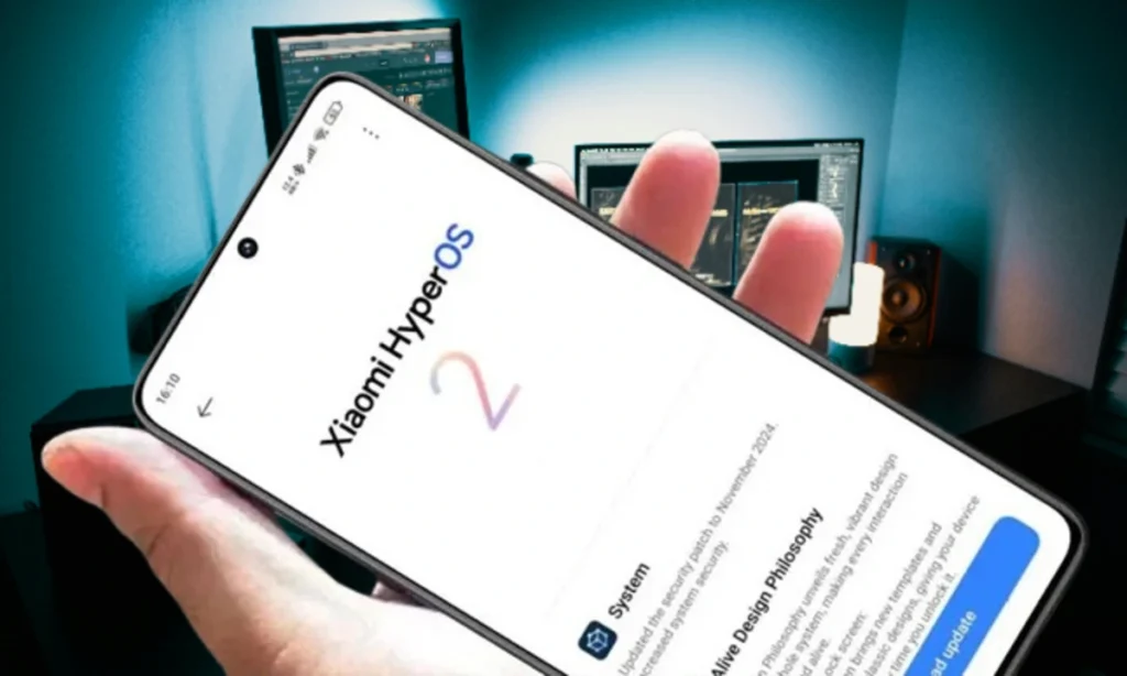 Smartphone Xiaomi exibindo a tela de atualização do HyperOS 2 com a logo "Xiaomi HyperOS 2" em destaque e informações de sistema.